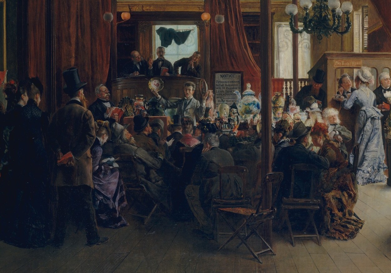 The room divides by gender. The seated bidders are uniformly male.