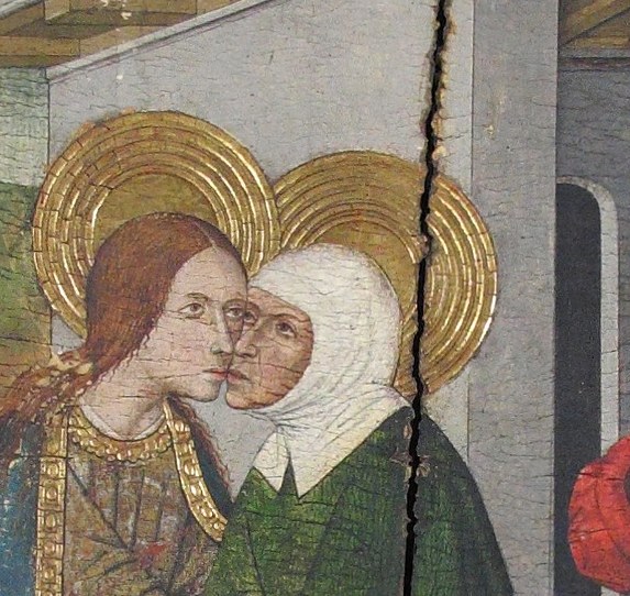 Elizabeth's older, lined features contrast with Mary's youth, marking her as the elder prophet-figure whose child leapt in recognition , the scene's drama lives in this face.