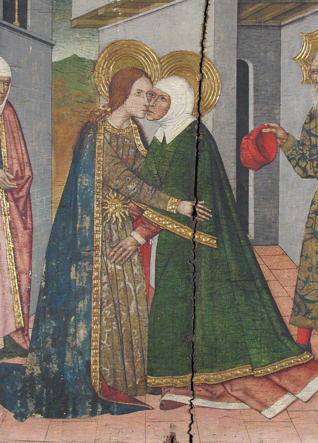 Mary, pregnant with Christ, visits her cousin Elizabeth.