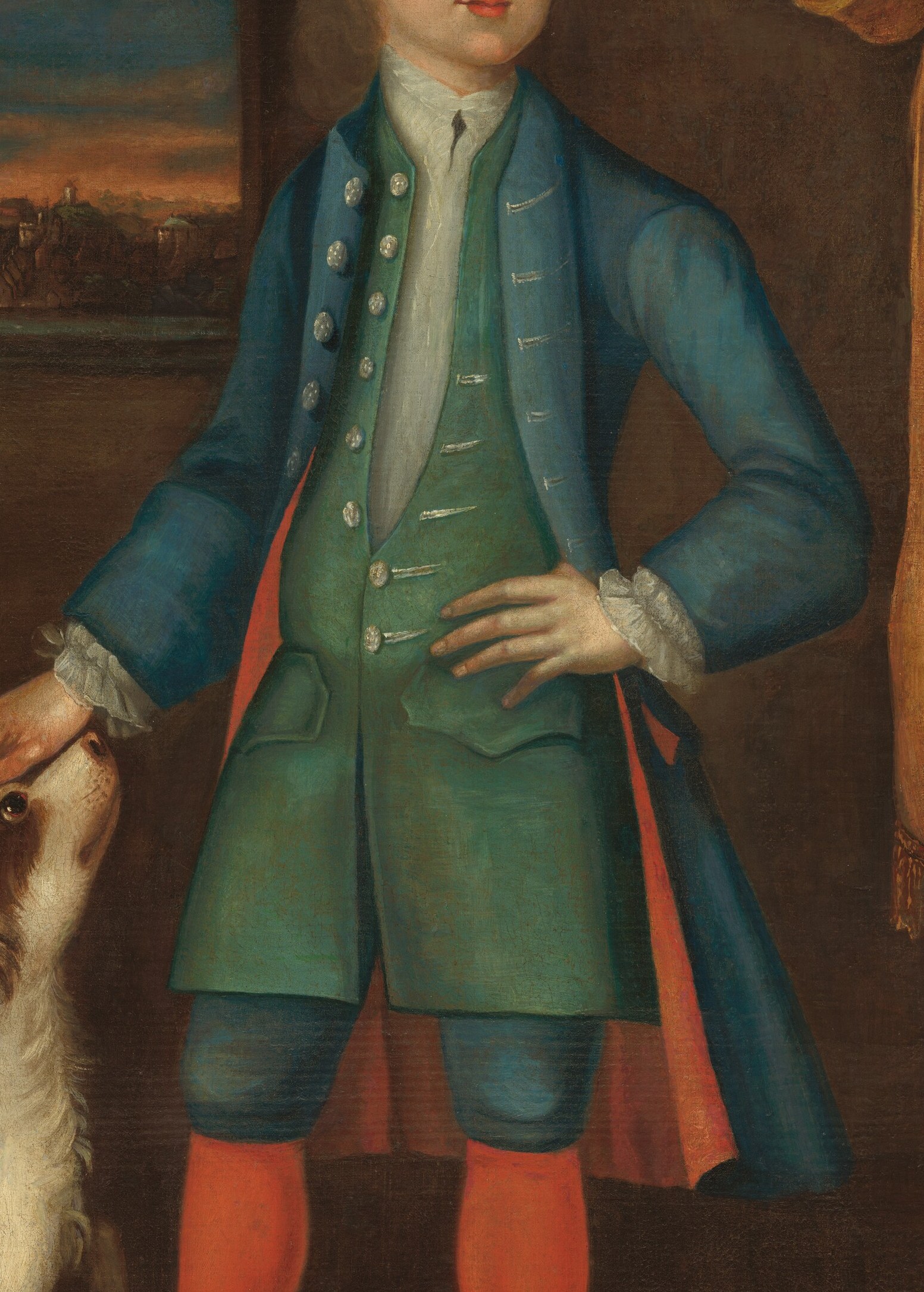This young man wears a rich blue coat.