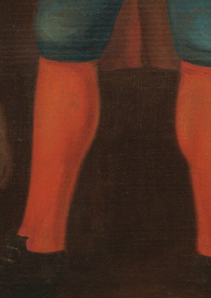 And vibrant orange stockings that draw the eye.