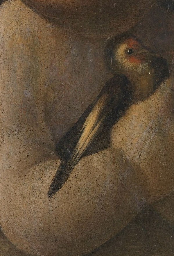 In his hand: a small bird.