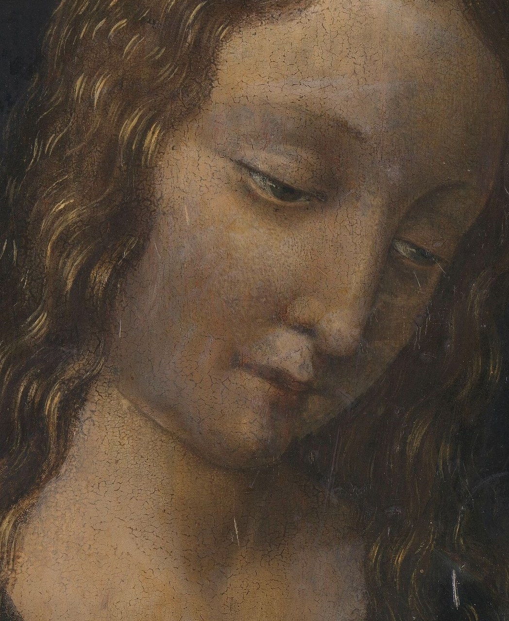 He carved Mary's face from shadow and a single light.