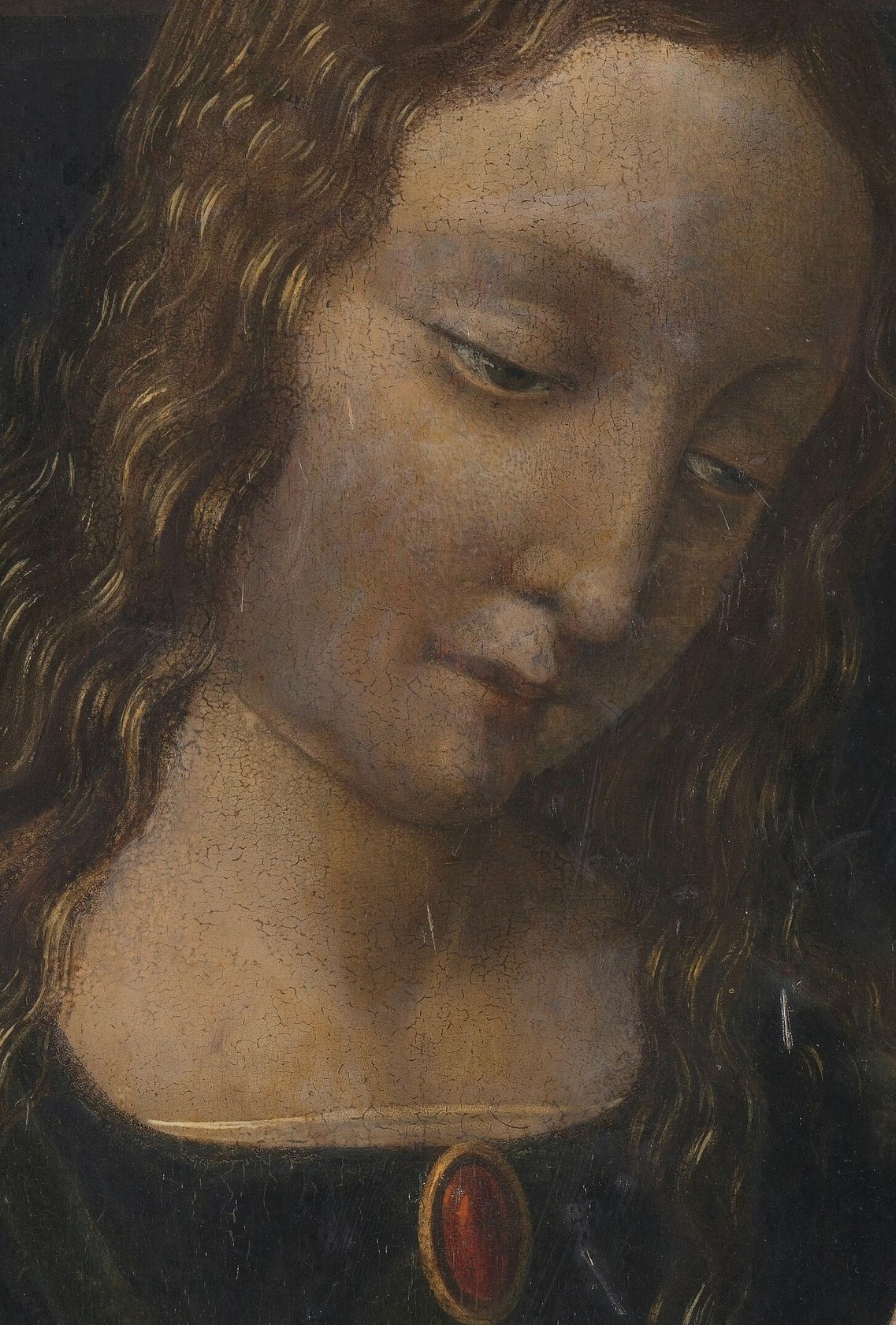 The soft, flowing curls contribute to the gentle, almost ethereal quality of the Virgin's appearance.