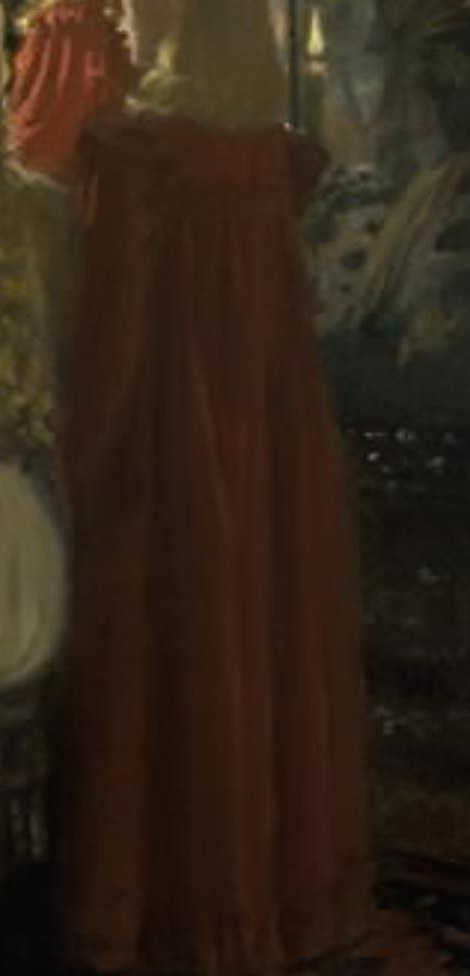 The vibrant color draws attention and contrasts with the softer tones of the other figures.