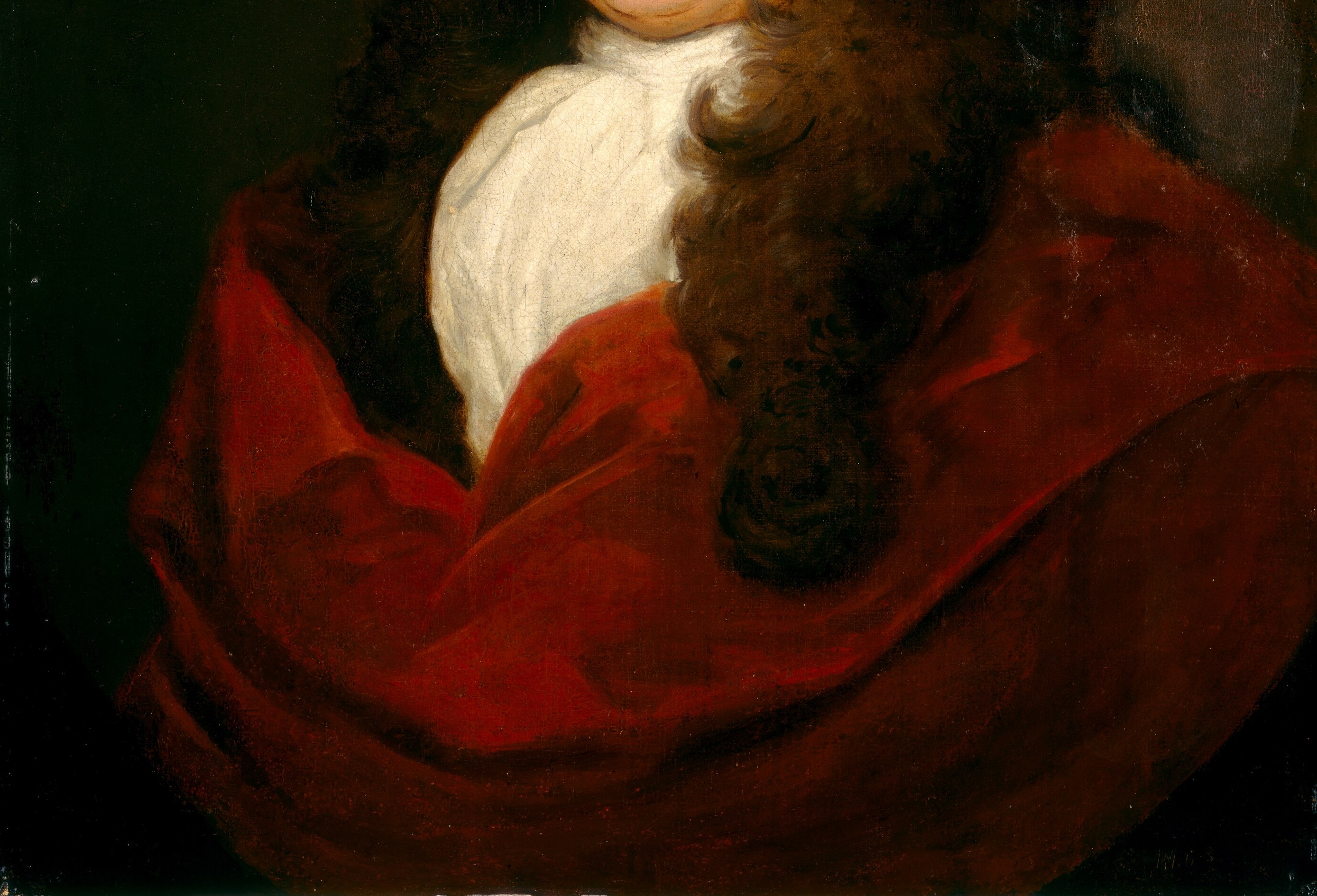 The crimson robe signals high rank.