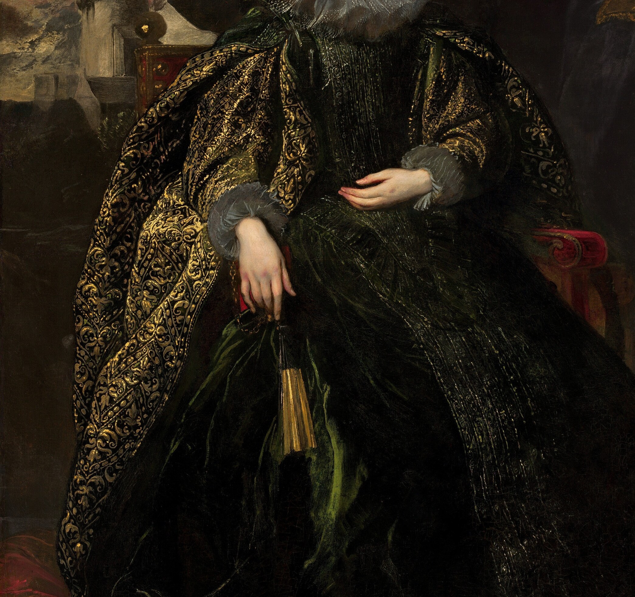 The gold embroidered mantle signals immense wealth.