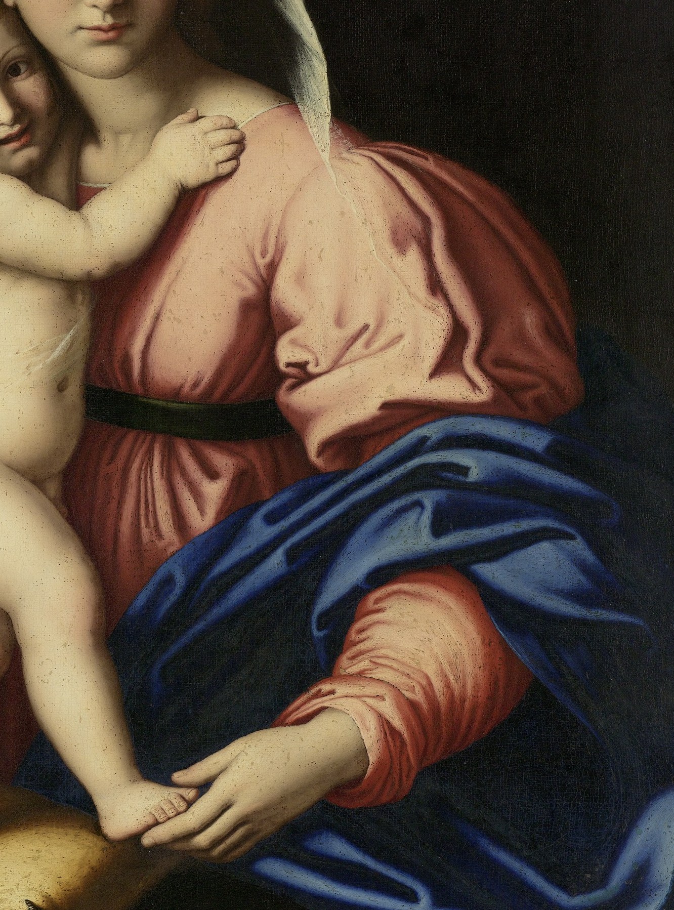 The warm pink counterbalances the cool blue mantle; Sassoferrato modeled flesh-toned garments with the same smooth finish he gave skin, unifying the palette.