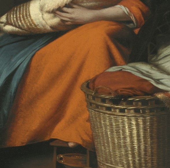 Her vibrant skirt anchors the warm interior.