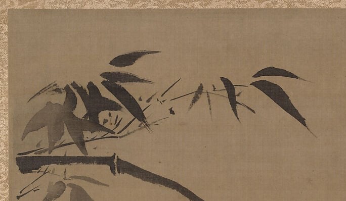 The boldly calligraphic bamboo leaves , each painted in a single loaded-brush swipe dark at base, pale at tip , are the compositional and symbolic anchor of the piece, expressing resilience in East Asian tradition