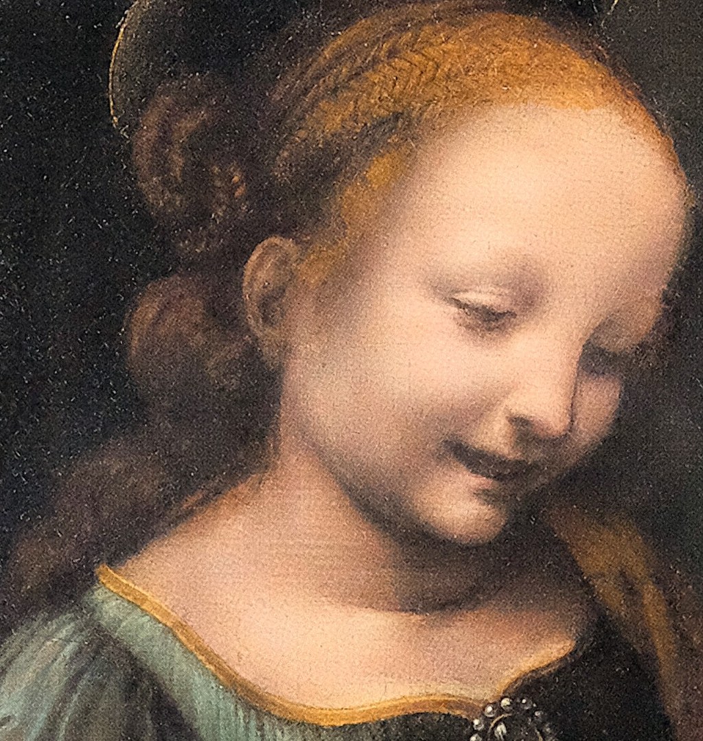 The Madonna's gentle gaze shows tender maternal affection.
