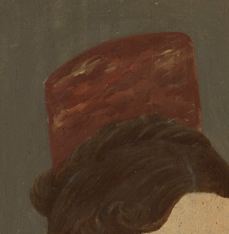 Look closely at her red hat and hairstyle.