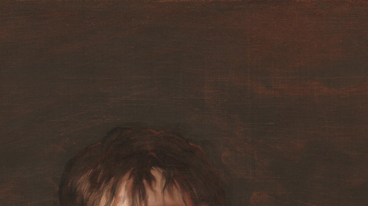 No powdered wig. His hair is windblown, natural.