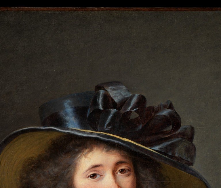 Her steady, self-possessed gaze meets the viewer directly , unusual confidence for a female portrait of this era, suggesting the sitter demanded to be seen as an intellectual equal