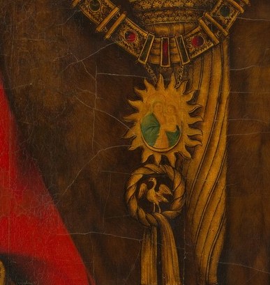 That pendant is a heraldic badge of his dynasty.