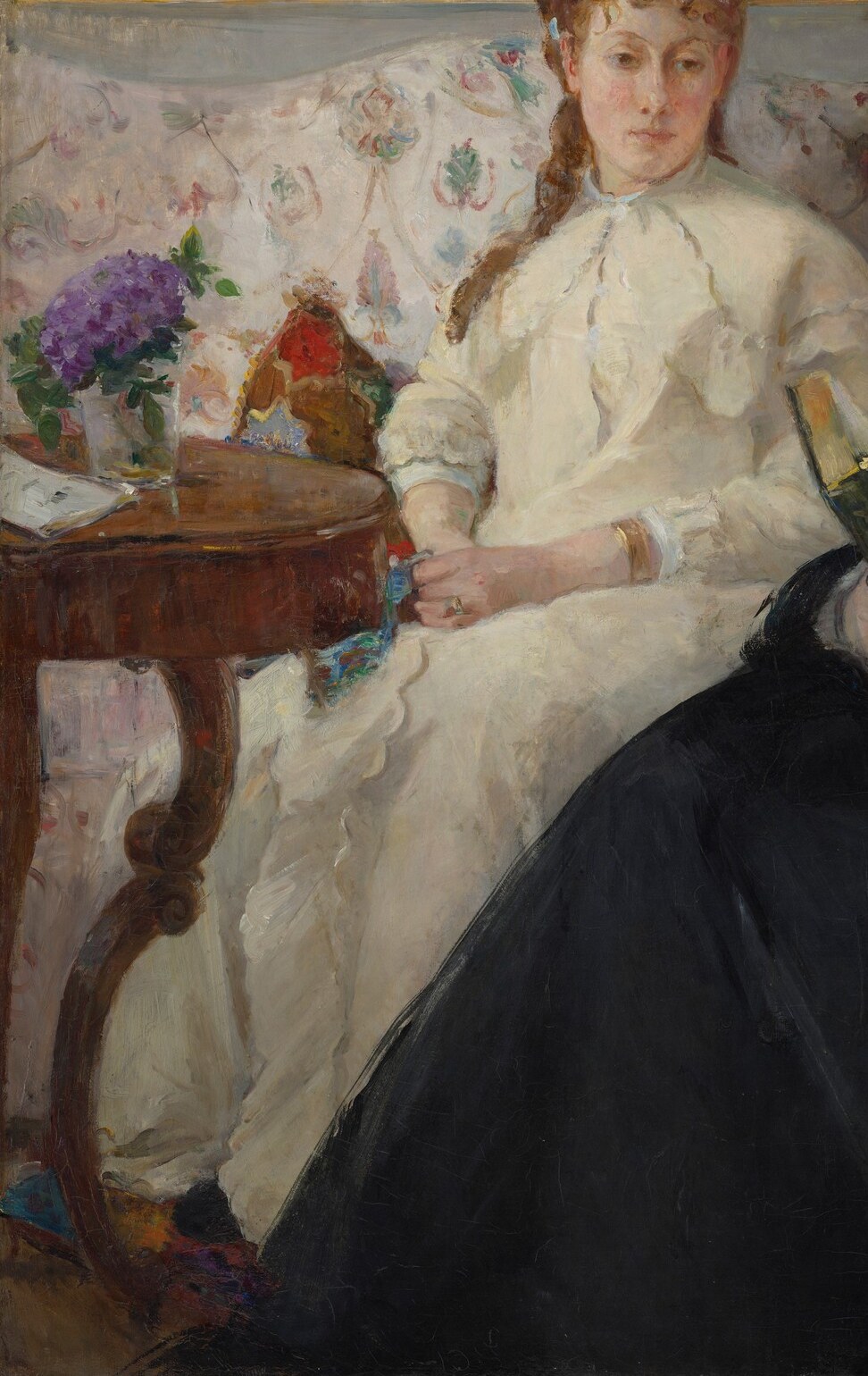 Morisot uses loose, confident strokes to render the fabric; the white mass fills the lower-left quadrant and pulls light into the composition in a way that shows her debt to Manet.