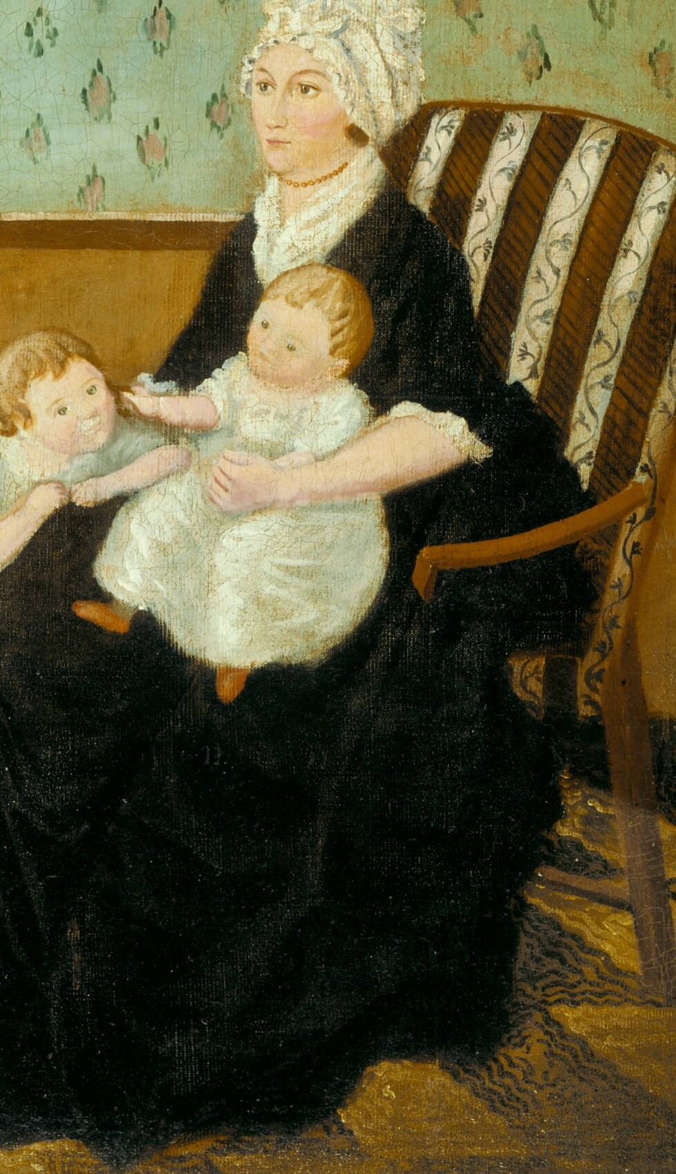 Maternal tenderness holds the infant.