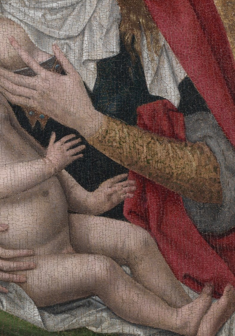 His gaze is directed towards his mother, suggesting a deep connection and dependence.