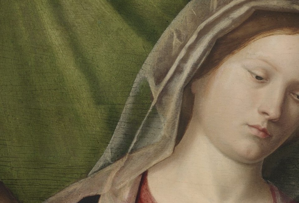 The infant's gaze direction , whether outward toward the viewer or toward the saints , determines the theological message of the whole panel.