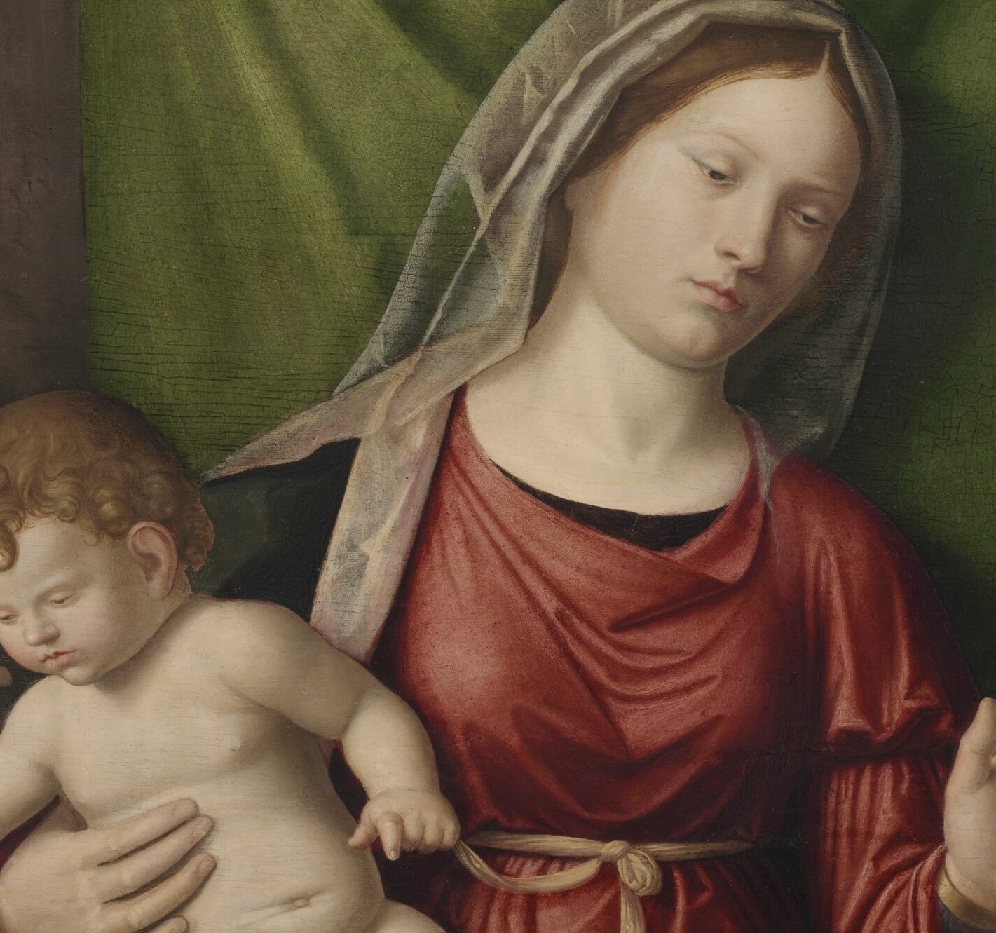 The nude infant is the theological core , his exposed flesh signals the Incarnation; his animated posture suggests blessing or reaching.