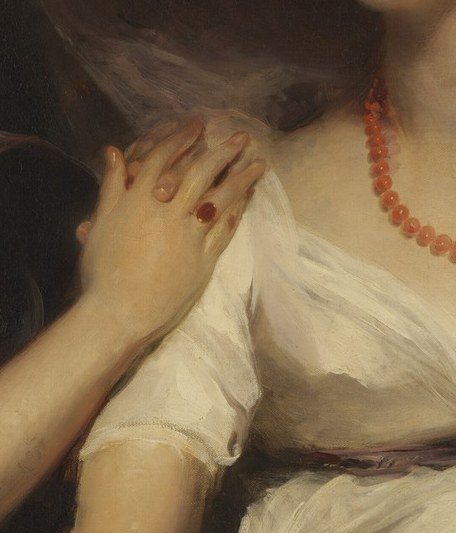Her sister's hand rests gently on her shoulder.