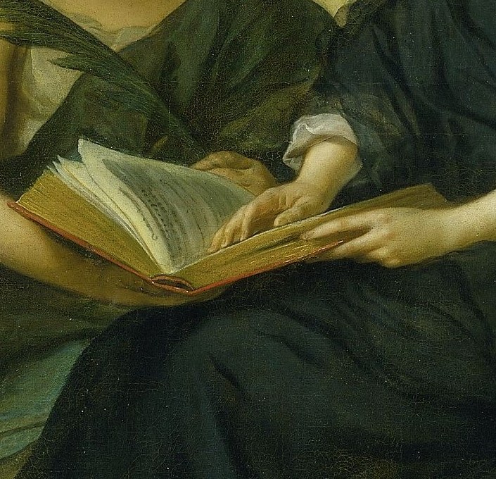 She gestures toward an open book, a record of his life.