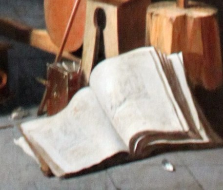Suggests study, scripture, or artistic plans, a common symbol in such workshops.