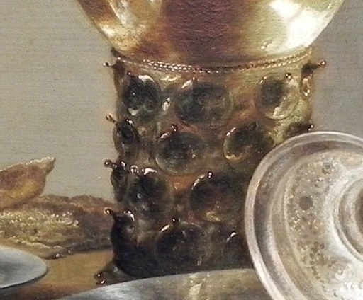The detailed, almost sculptural base adds a sense of opulence and craftsmanship to the everyday objects.