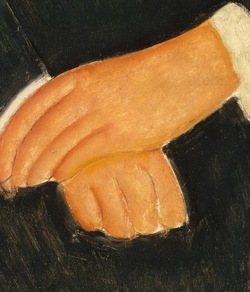 Her hands are folded in a quiet pose.