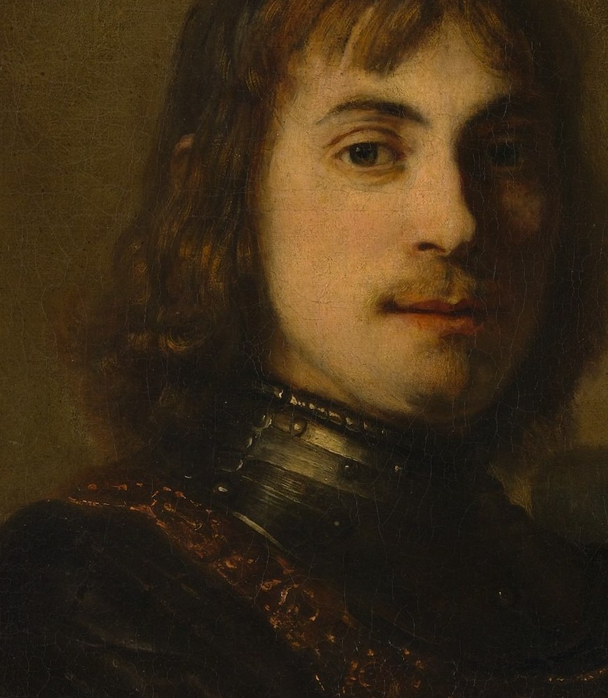 A focused warm highlight precisely defines the cheek plane; the razor-thin transition from highlight to mid-tone to shadow here is the single best passage to demonstrate Rembrandt's technique to a camera