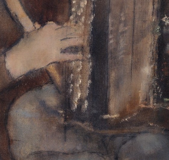His hands show a practiced familiarity with the accordion.