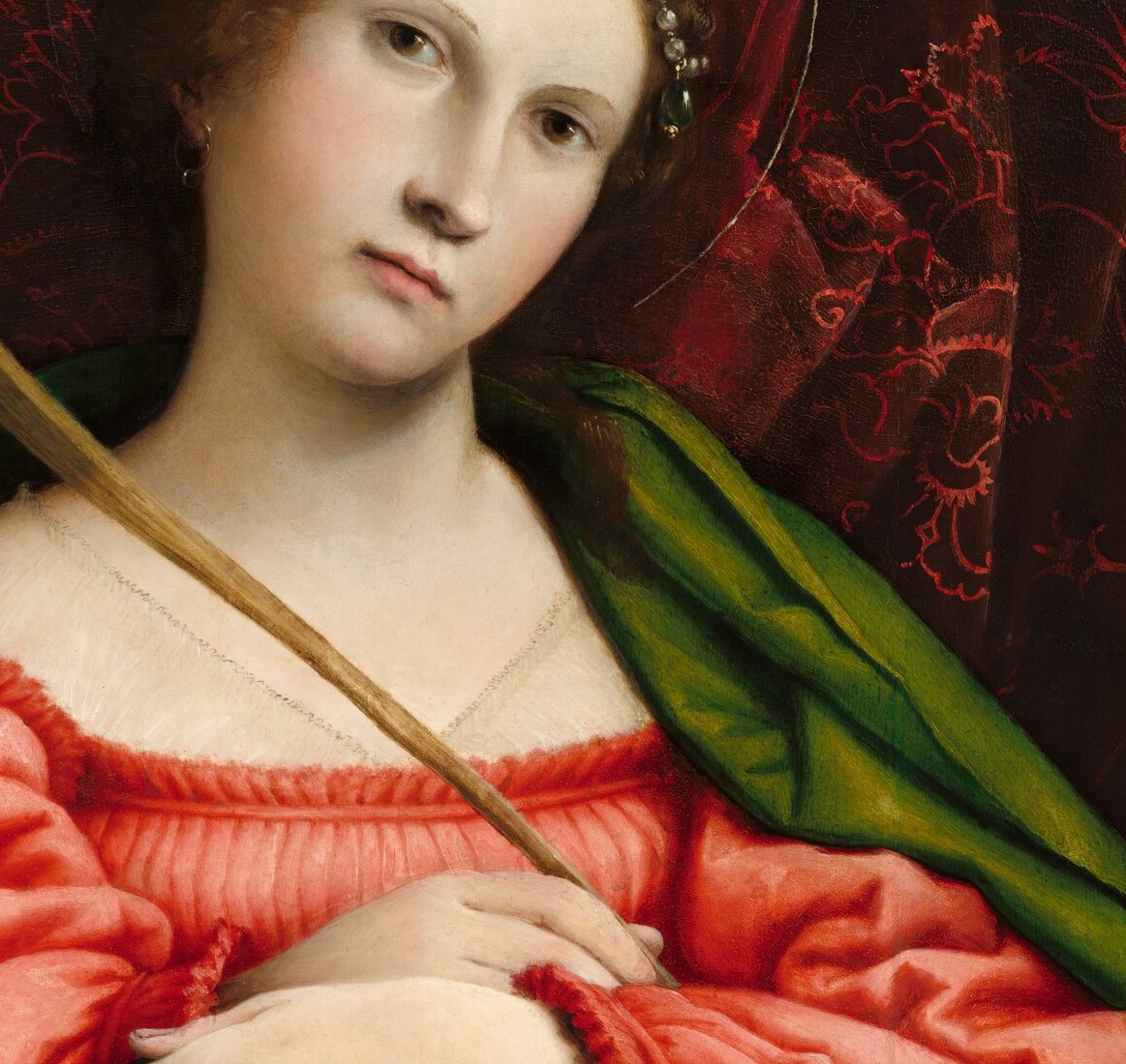 The blazing red creates simultaneous contrast against the green cloak; technically ambitious for 1522, it echoes Venetian colorism and carries the symbolic charge of martyrdom blood.