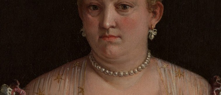 Her pearls spell purity and wealth, layered to catch the light.