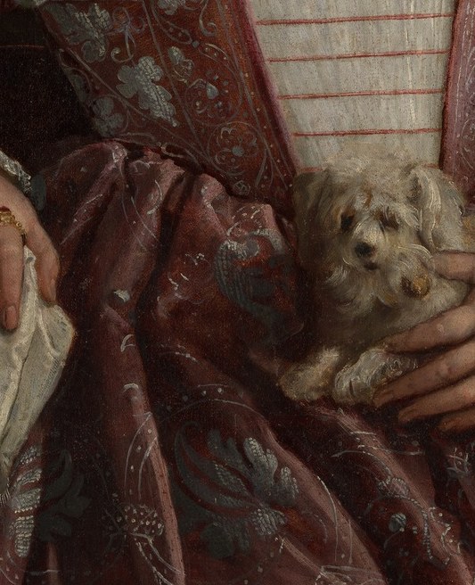 And in her arm, a white lap dog, the era's symbol of fidelity.
