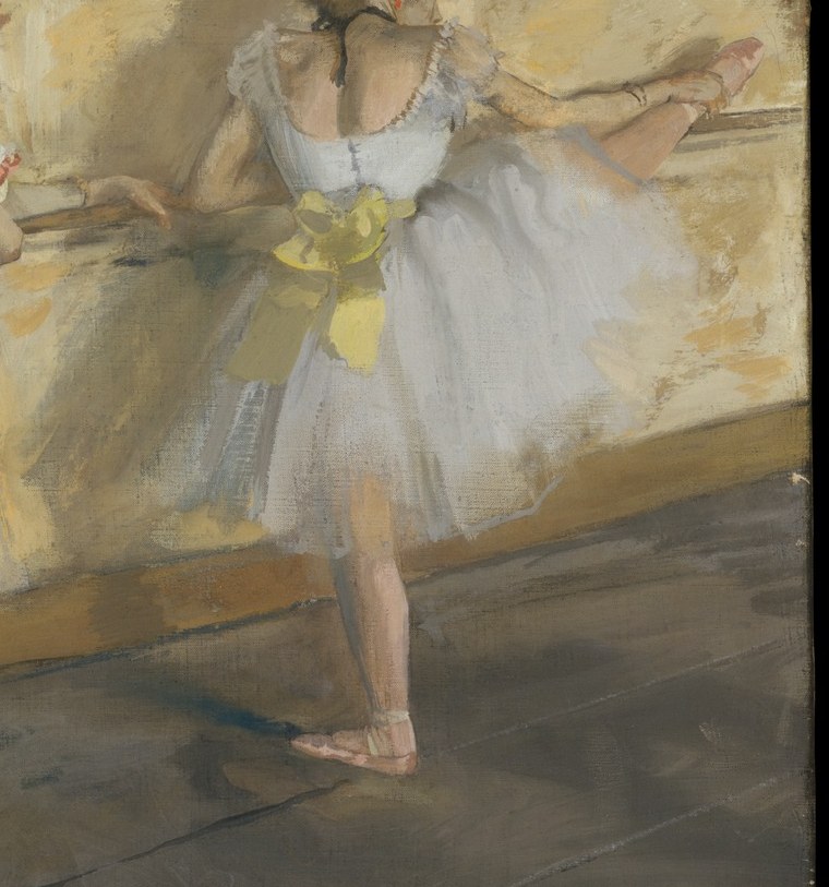 This dancer leans, arms extended, perfecting her form.