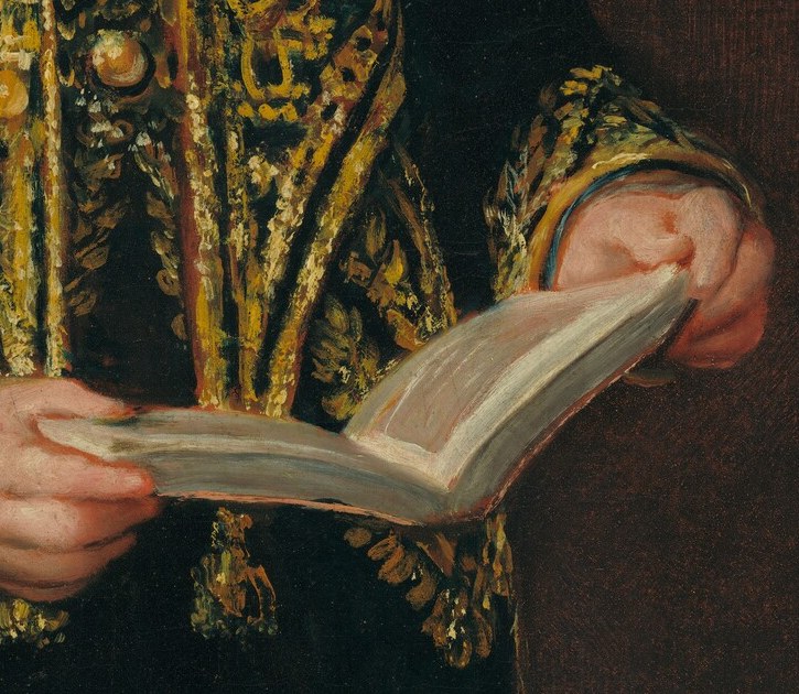 The open book in his hands suggests a love of learning.