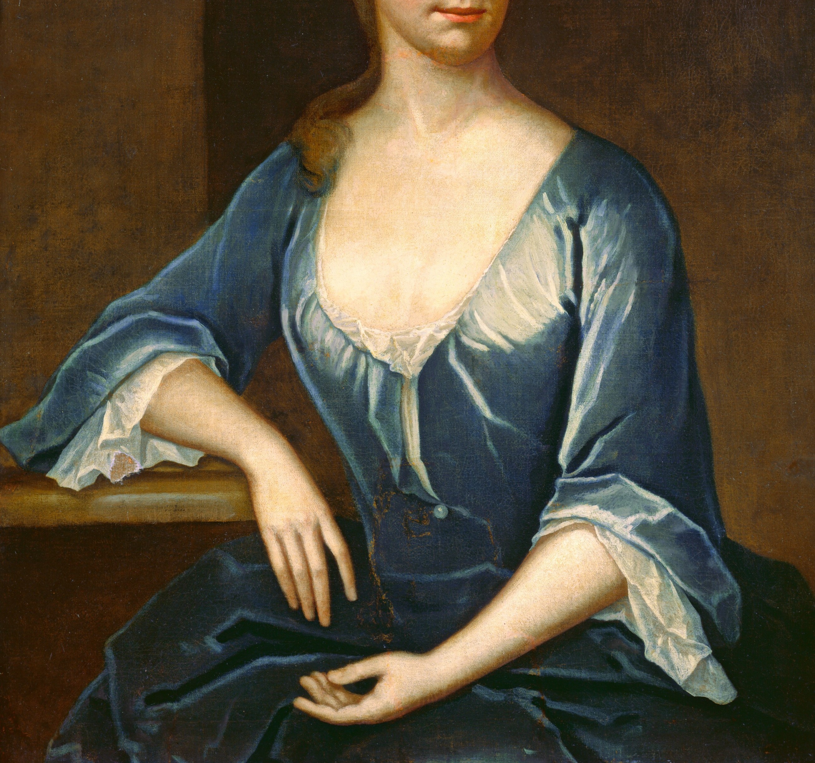 This blue silk dress with its low neckline announced her wealth.