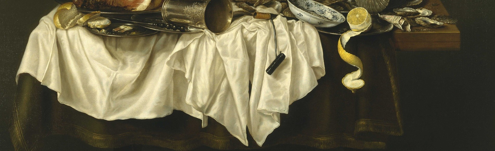 He captures the crisp folds of the white tablecloth.