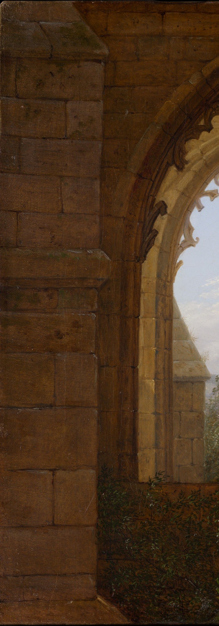 The rough texture and muted colors of the stone suggest age, decay, and the passage of time.