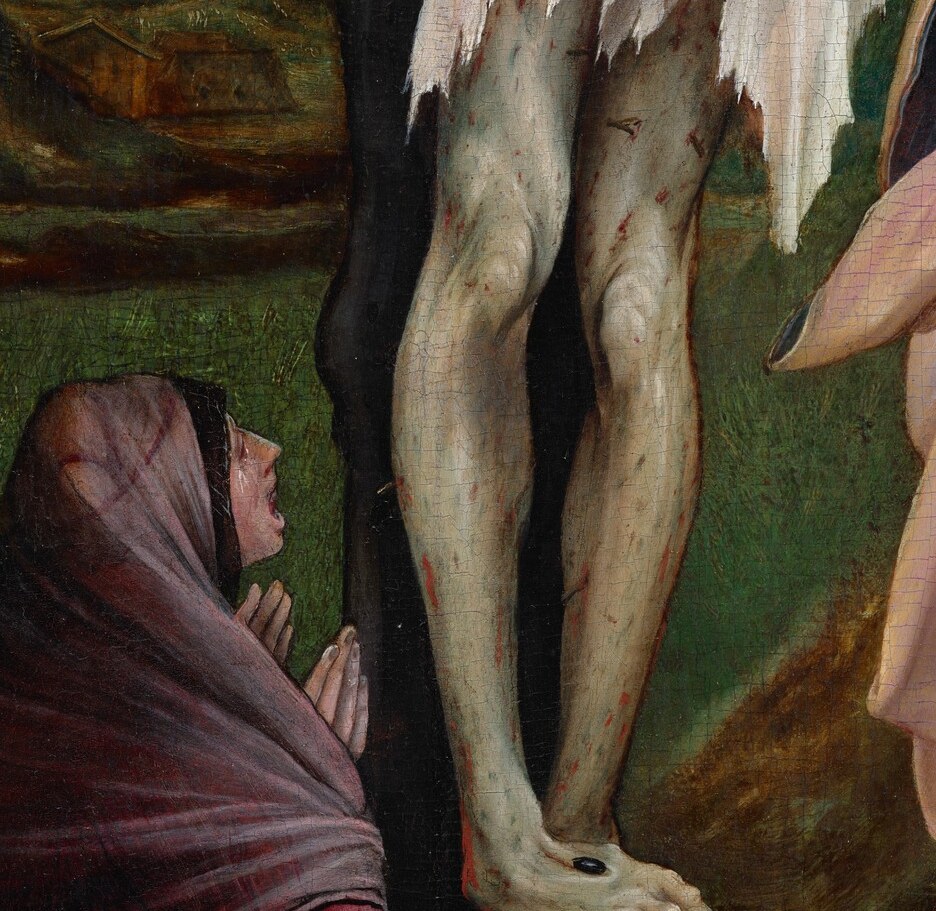 Feet twisted inward and spiked together, flesh darkened , a focal point of physical realism that anchors the body's weight on the cross.