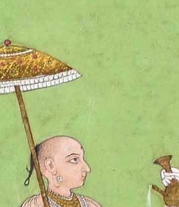 He carries an umbrella, a symbol of high status.