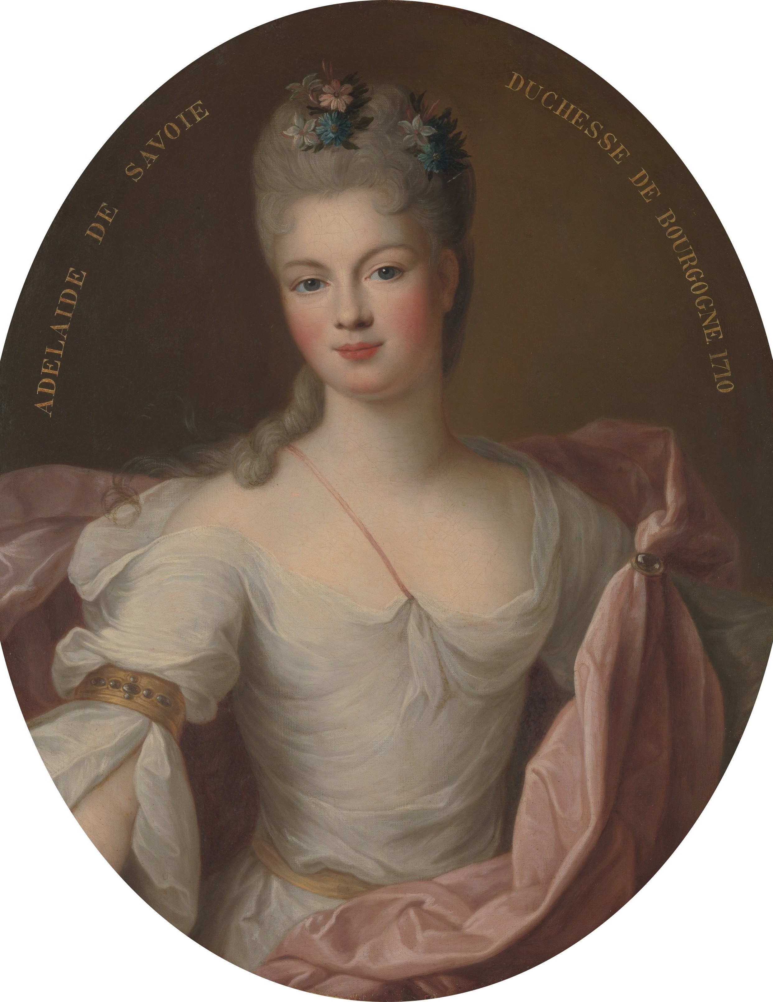 The painted oval is part of the composition, not a physical frame , a trompe-l'oeil device blending painting and frame that was fashionable in French court portraiture.