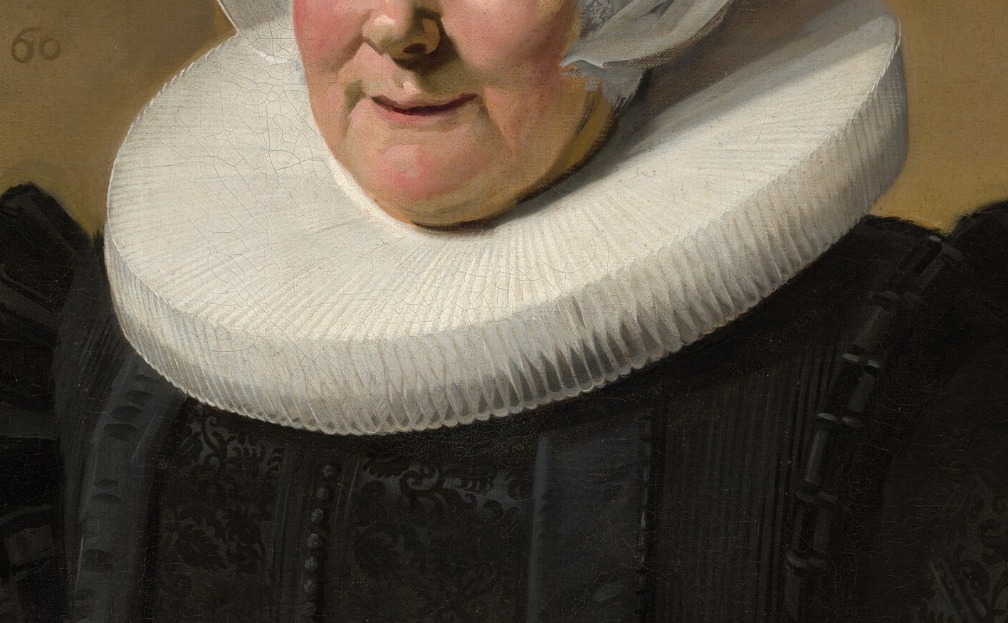 This starched collar was a costly status symbol; its razor-sharp pleats against the black dress create the painting's central graphic contrast and frame the face like a halo.