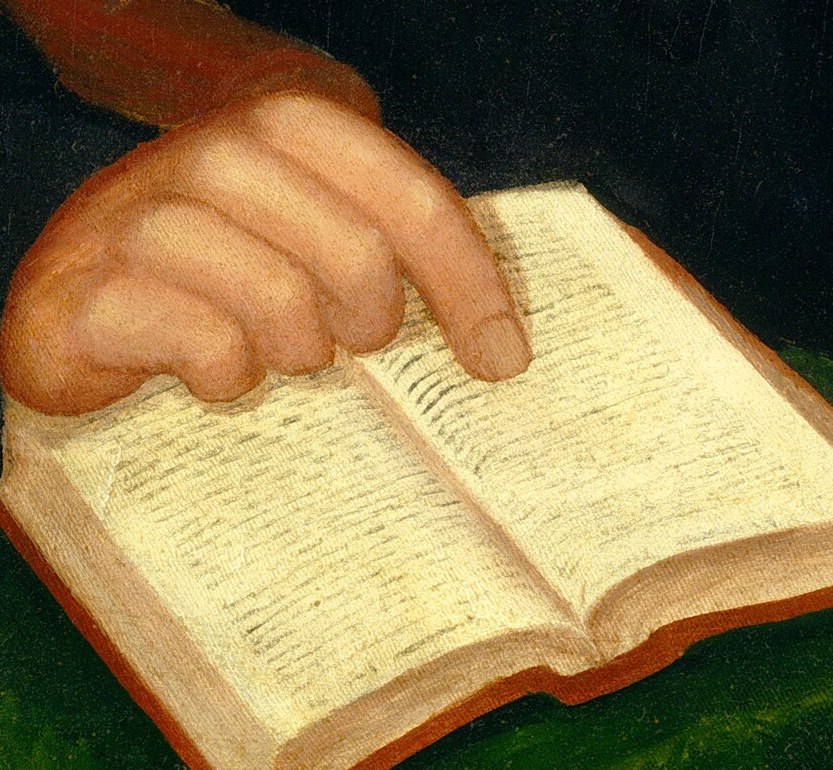 But his left hand holds the book very carefully.