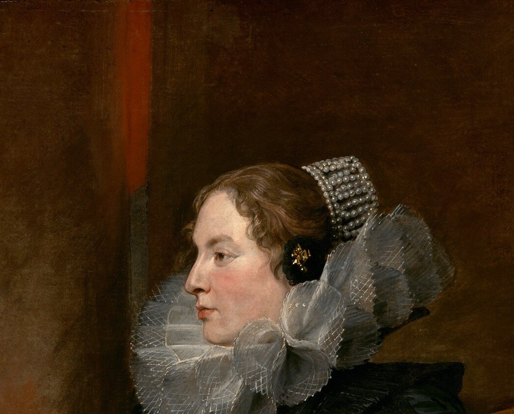 And her intricate lace cap and prominent hair bow, a sign of high status.