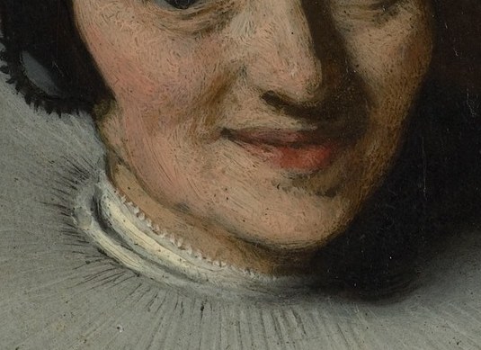 This woman almost smiles.