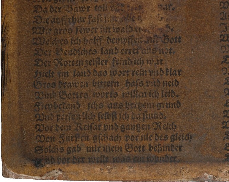 Look below the coat. Two dense blocks of text.