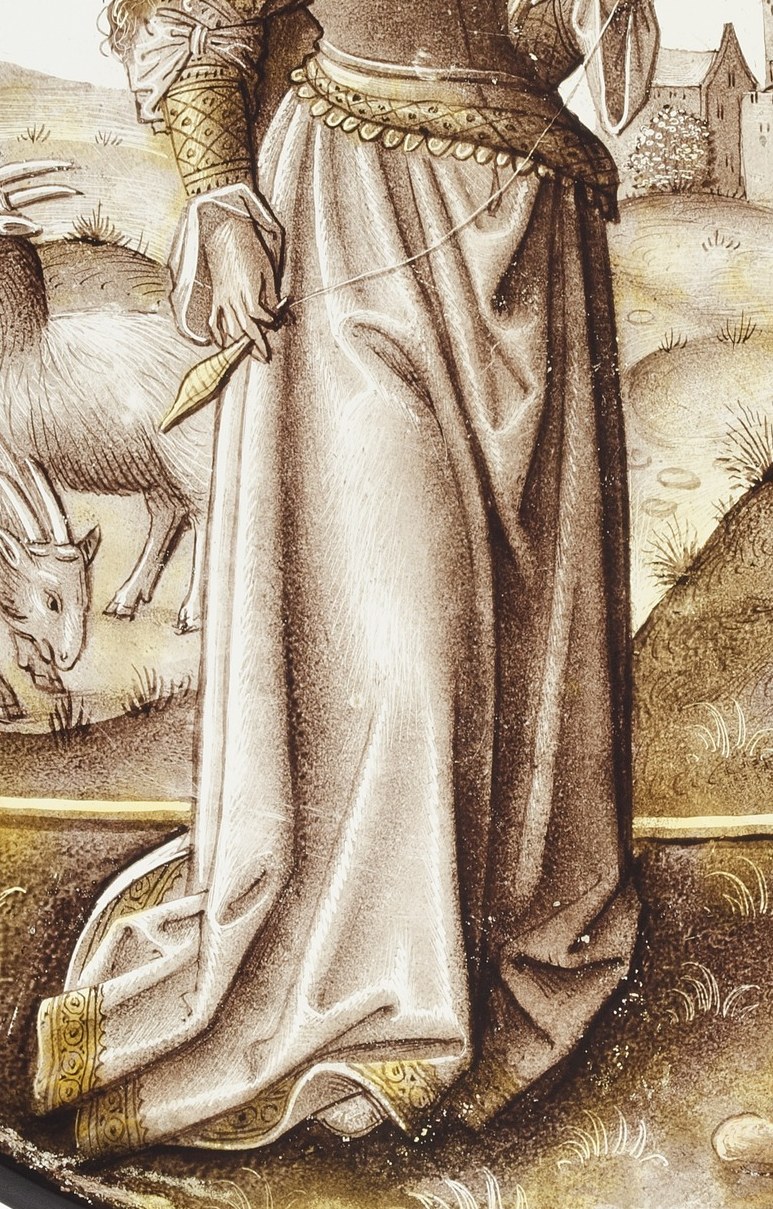 She wears a fur-trimmed cloak, a sign of her importance.