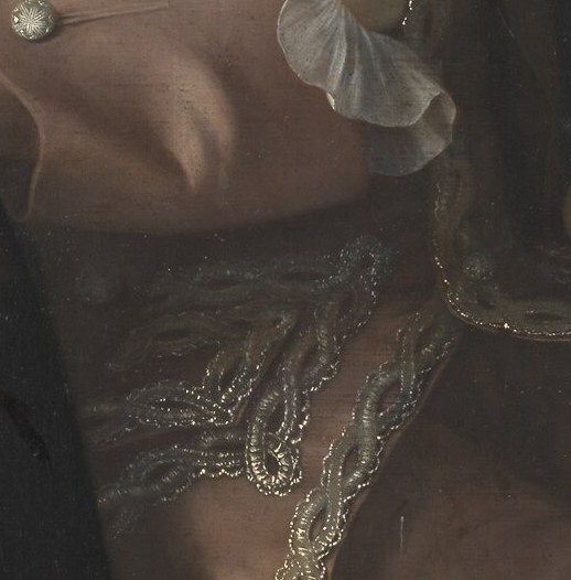 His fine waistcoat and powdered wig show his status.