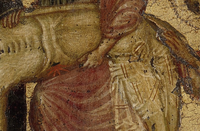 The body, wrapped in white, is the center.